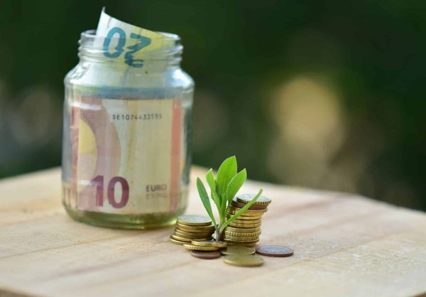 How can tourists save money on accommodation while exploring the Cotswolds?